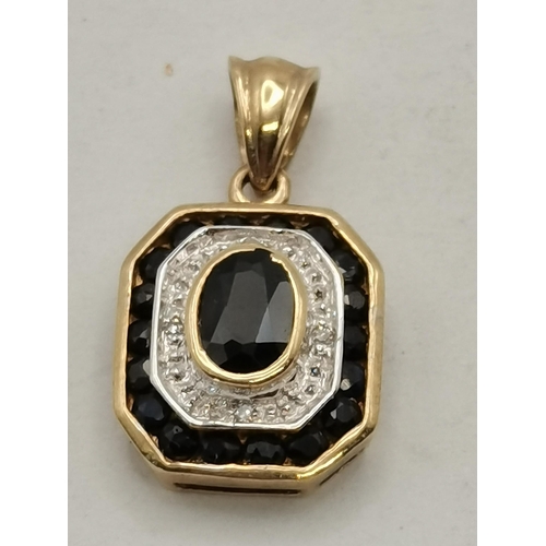 472 - A 9 carat gold blue and white stone octagonal pendant, the oval central blue stone to a white-metal ... 