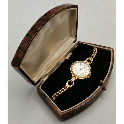 472A - A 9 carat gold lady's bracelet wristwatch, the 15mm cream circular dial unsigned, with Arabic numera... 