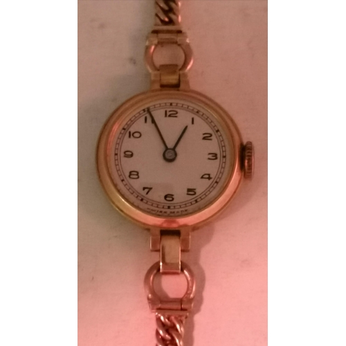 472A - A 9 carat gold lady's bracelet wristwatch, the 15mm cream circular dial unsigned, with Arabic numera... 