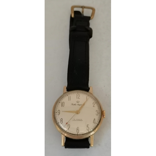 473A - Two 9 carat gold wristwatches, comprising a gent's strap wristwatch, the cream 29mm dial signed 'Smi... 