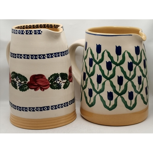 277 - Two large cylinder jugs by Nicholas Mosse Pottery, Ireland, one decorated with blue tulips, the othe... 