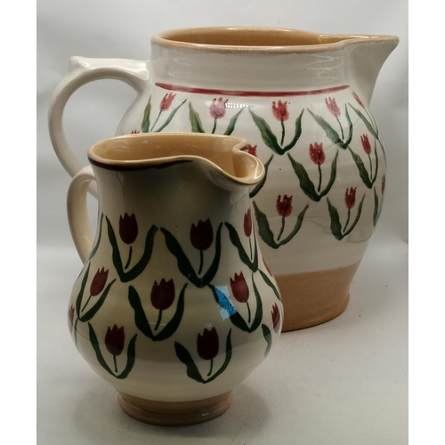 279 - Two jugs by Nicholas Mosse Pottery, Ireland, different sizes and shapes, both decorated with red tul... 