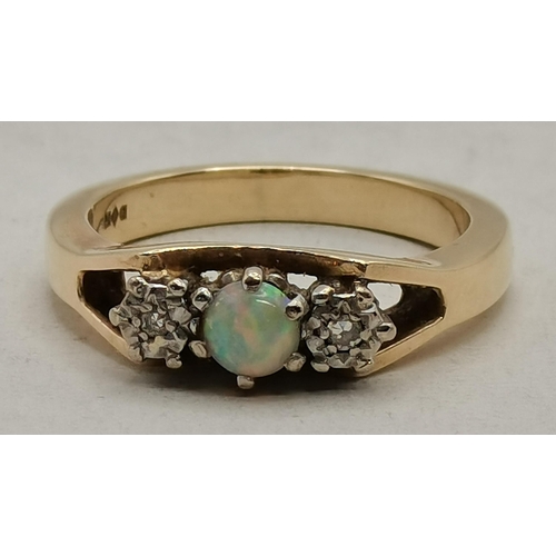 474B - A 9 carat gold cluster ring, the central blue stone surrounded by eight small white stones, in a fan... 