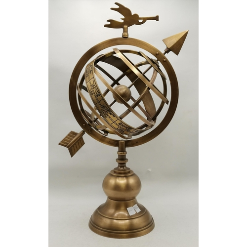 519A - A brass armillary sphere, modern, raised on a knopped and spreading circular base, surmounted by the... 