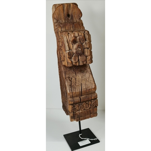 521 - Three carved Indian hardwood brackets, with flowerhead decoration, each mounted on later steel squar... 