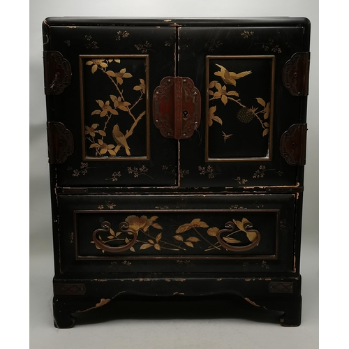 522 - A Japanese black lacquered tabletop cabinet, 19th Century, with gilded decoration of foliage and bir... 