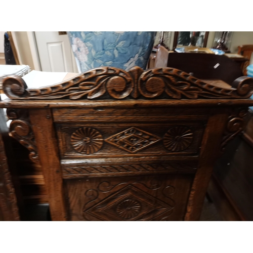 656 - 2 x early oak hall/ church chairs with carved decoration