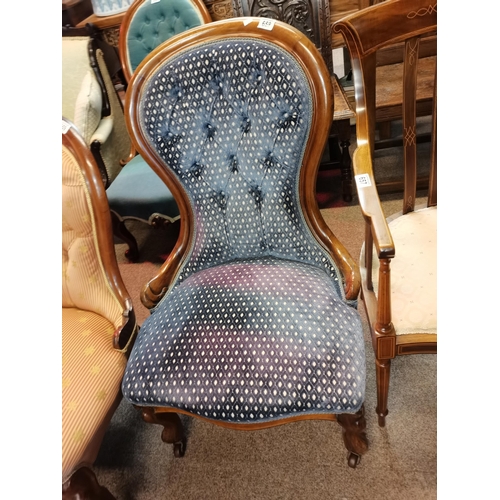 658 - A Victorian mahogany nursing chair chair