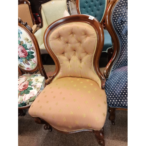 659 - A Victorian mahogany nursing chair chair