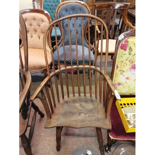 666 - An early stick back Windsor chair ( having metal bracket repair)