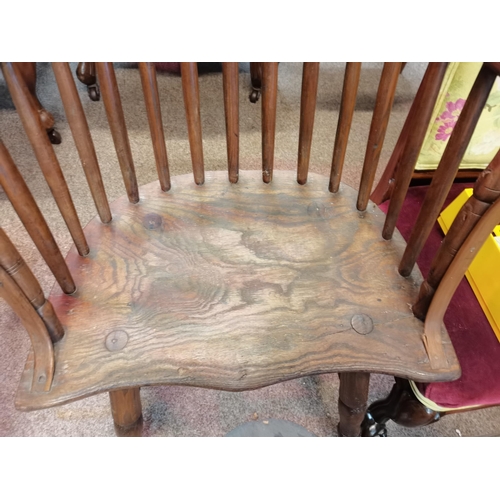 666 - An early stick back Windsor chair ( having metal bracket repair)