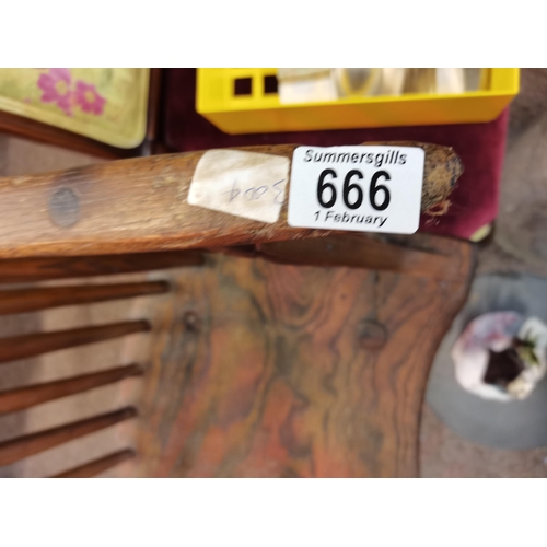 666 - An early stick back Windsor chair ( having metal bracket repair)