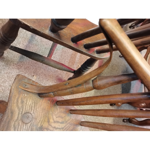 666 - An early stick back Windsor chair ( having metal bracket repair)