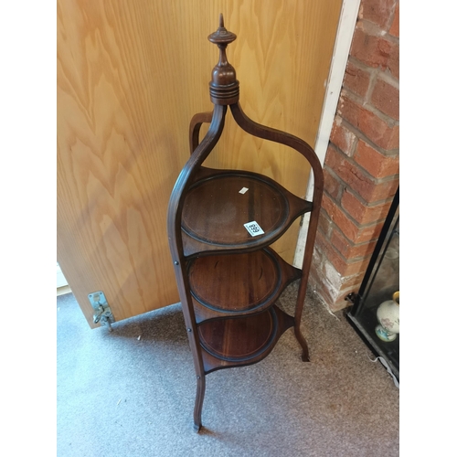 668 - An Edwardian mahogany with inlay 3 tier circular cake stand