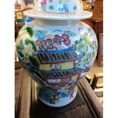 672 - A good pair of Chinese tea jars 45cm high decorated with trees and people