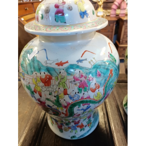 672 - A good pair of Chinese tea jars 45cm high decorated with trees and people