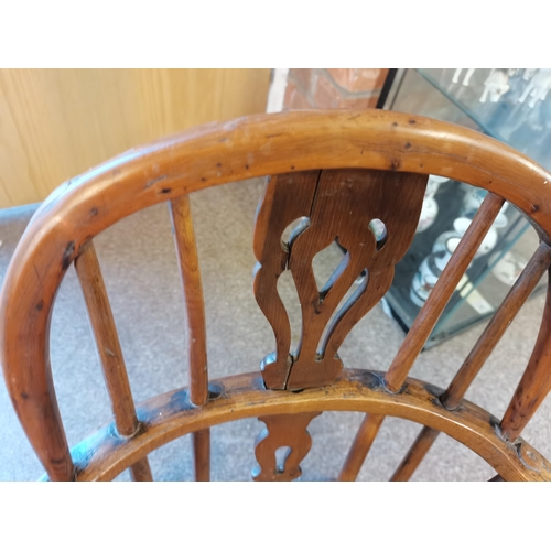 699 - A Childs Windsor chair YEWOOD