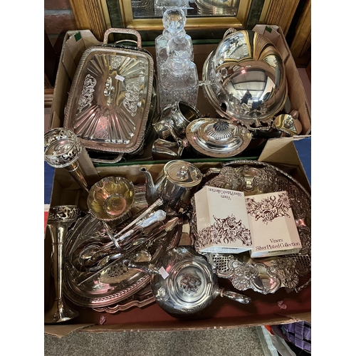 752 - A quantity of silver plated wares, including swing-handled pedestal basket, teapots, pair of candles... 