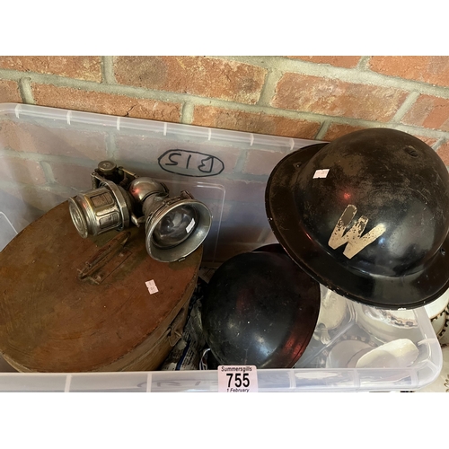 755 - A WWII ARP Warden helmet, another similar (with target decal, no lettering), a metal hat box, a lamp... 