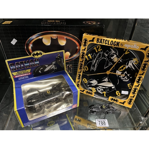 788 - Batman: A small group of merchandise, comprising Batman The Game; Batclock by apollo; Batmobile moto... 