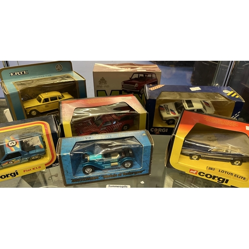 790 - A collection of seven die-cast model vehicles, in display original boxes, including a Lotus Elite by... 