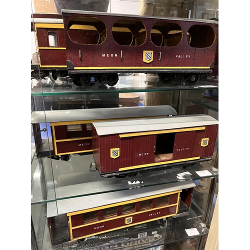 796 - Five wooden model Meon Valley railway carriages, in maroon and yellow livery. (5) Largest 50cm long