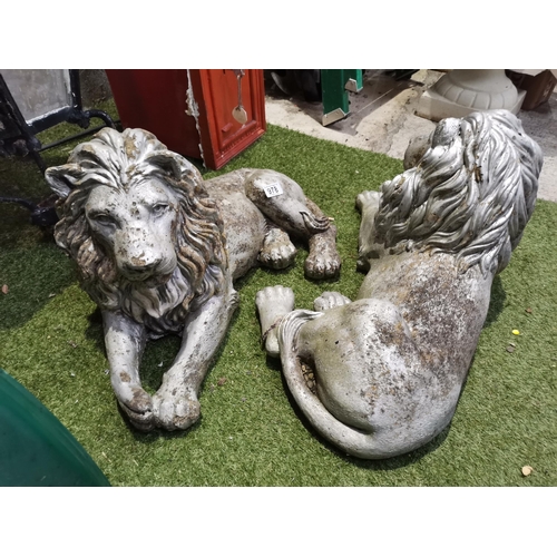 978 - Pair of seated stone garden lions 67cm length (A/F)