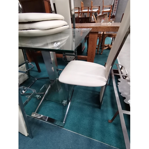 1072 - Square glass and chrome dining table with 4 matching high backed cream leather and chrome chairs.  T... 