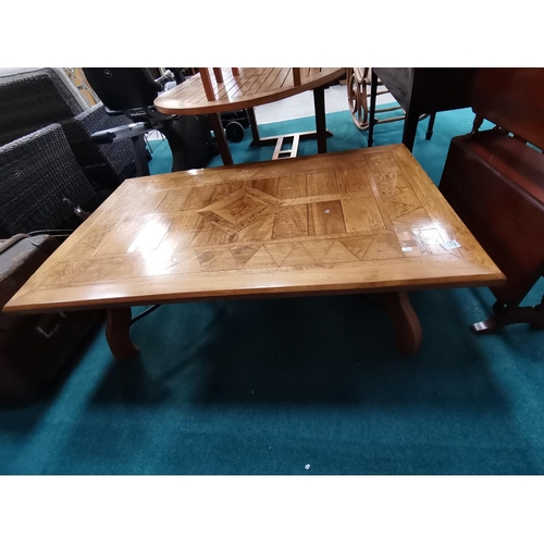 1082 - Large inlaid coffee table with mixed woods  130xm x 78cm