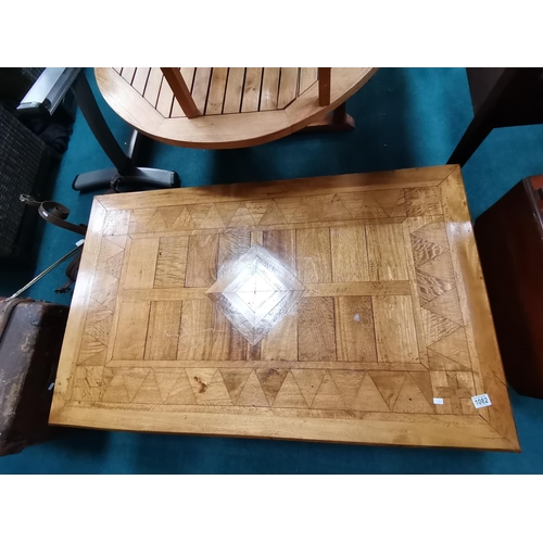 1082 - Large inlaid coffee table with mixed woods  130xm x 78cm