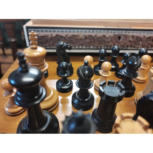 250 - Chess pieces in carved wooden box height of king 7.5cm weight of chess pieces 245grams