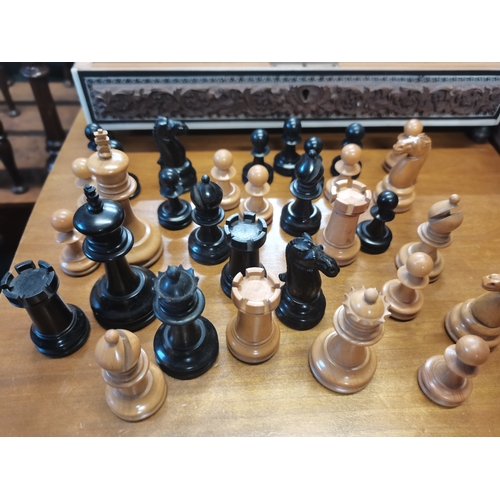 250 - Chess pieces in carved wooden box height of king 7.5cm weight of chess pieces 245grams