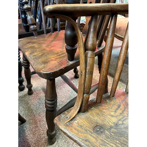 666 - An early stick back Windsor chair ( having metal bracket repair)