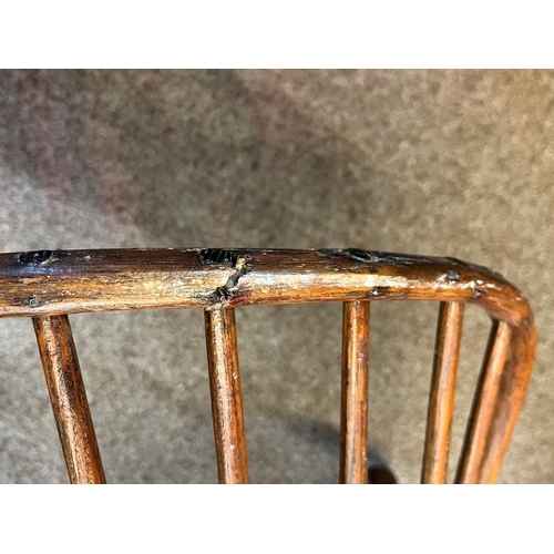 666 - An early stick back Windsor chair ( having metal bracket repair)