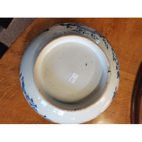 191 - A large blue and white ceramic punch bowl, early 19th Century, decorated in the Chinese taste with f... 