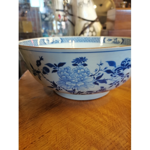 191 - A large blue and white ceramic punch bowl, early 19th Century, decorated in the Chinese taste with f... 