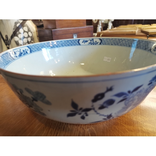 191 - A large blue and white ceramic punch bowl, early 19th Century, decorated in the Chinese taste with f... 