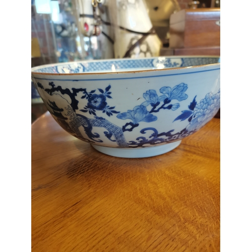 191 - A large blue and white ceramic punch bowl, early 19th Century, decorated in the Chinese taste with f... 