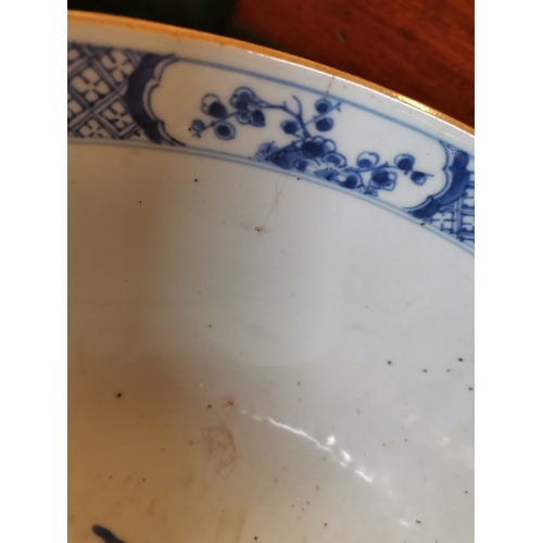 191 - A large blue and white ceramic punch bowl, early 19th Century, decorated in the Chinese taste with f... 