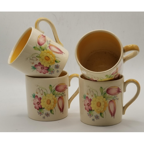 105 - A yellow 'Swansea Spray' Kestrel part-coffee set by Susie Cooper, mid-1930s, comprising coffee pot a... 