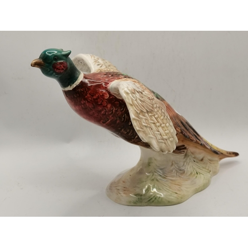 155 - Two Beswick bird models comprising Pheasant Taking Off, model no. 850, and Red Cardinal bird, model ... 