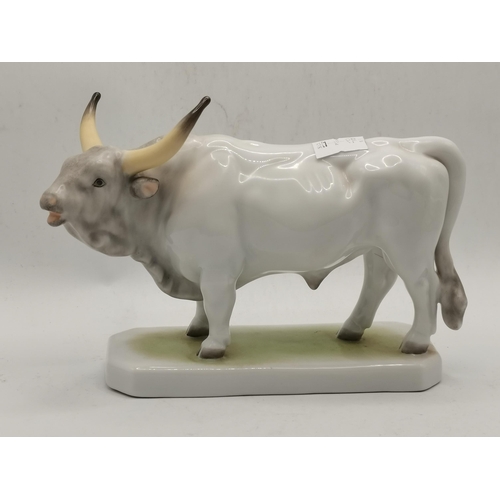 165 - A Herend porcelain bull figure, c.1955, with blue printed backstamp; together with a Herend duck fig... 