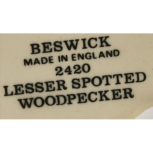 171 - Two Beswick bird models comprising Jay, model no. 1219, and Lesser Spotted Woodpecker, model no. 242... 