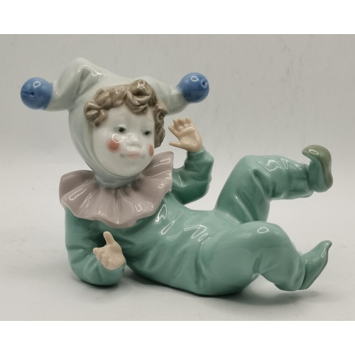 184 - A group of three Nao porcelain child figures, as infant jesters. (3) Tallest 13cm high