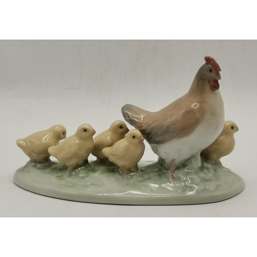 185 - Two Nao porcelain animal figure groups of geese and a hen and chicks, together with a Lladro group o... 