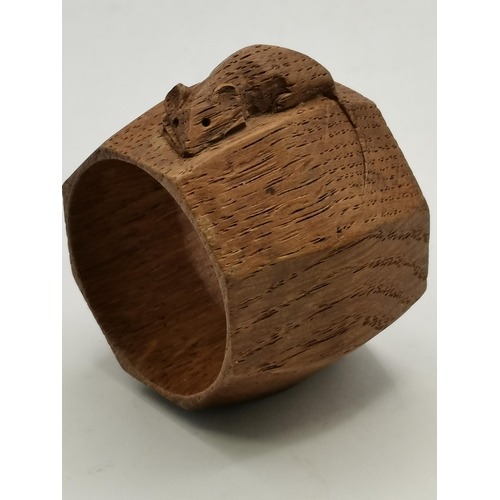 202 - Robert Thompson, a pair of Mouseman oak napkin rings, baluster octagonal, each with carved mouse sig... 