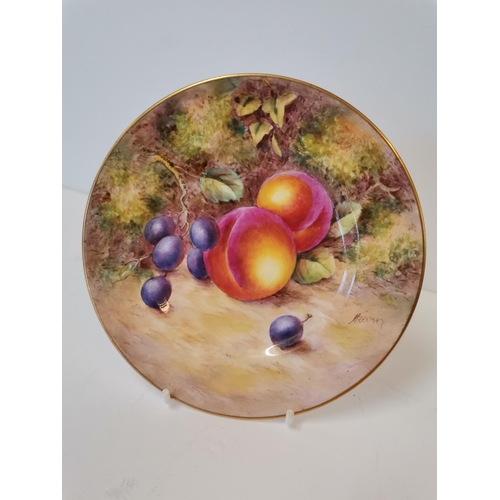 230O - A Royal Worcester side plate by John Freeman, date code 1953, painted with fruit, signed. 15.5cm dia... 