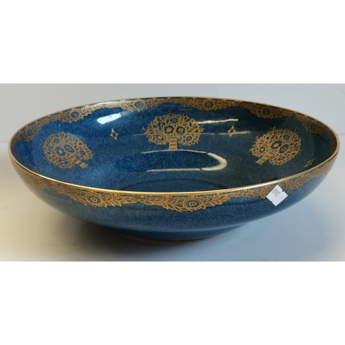 24A - A large Royal Worcester bowl, pattern no. 2577, date code 1918, the mottled blue ground with gilt fl... 