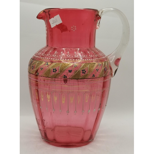 26 - A group of cranberry glassware comprising a Victorian oil lamp with square brass base; a Victorian l... 