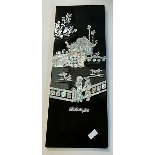 29 - Four oriental black lacquered and mother-of-pearl decorated wooden panels, depicting boating figures... 